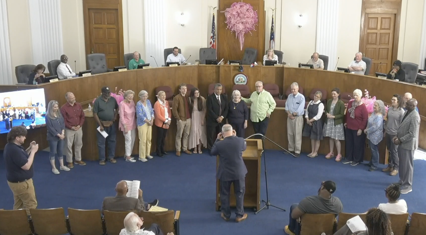 Macon-Bibb County's mayor and commissioners honored retiring "Library Lady" Suzy McCullough who also taught County Manager Keith Moffett in elementary school.
